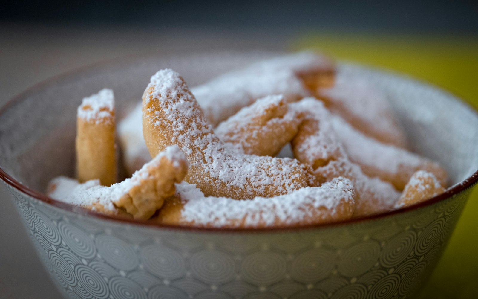 Fried dough beignets covered in powdered sugar