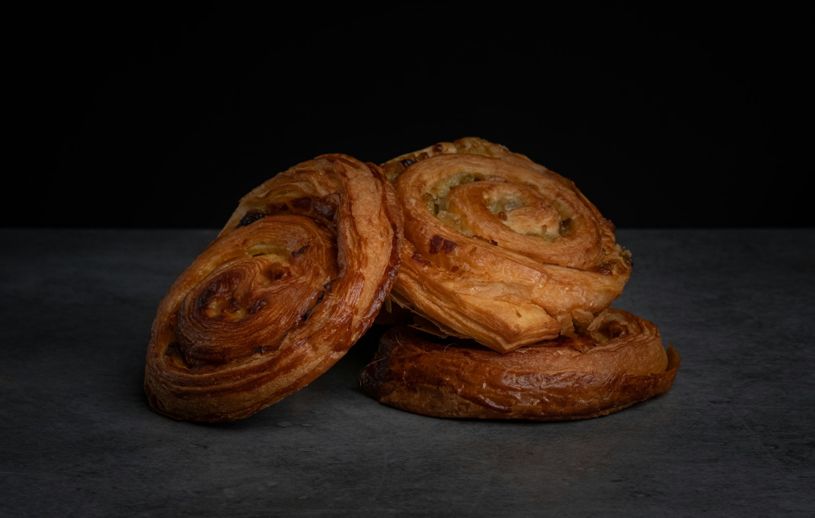Flaky Danish pastries with a golden swirl