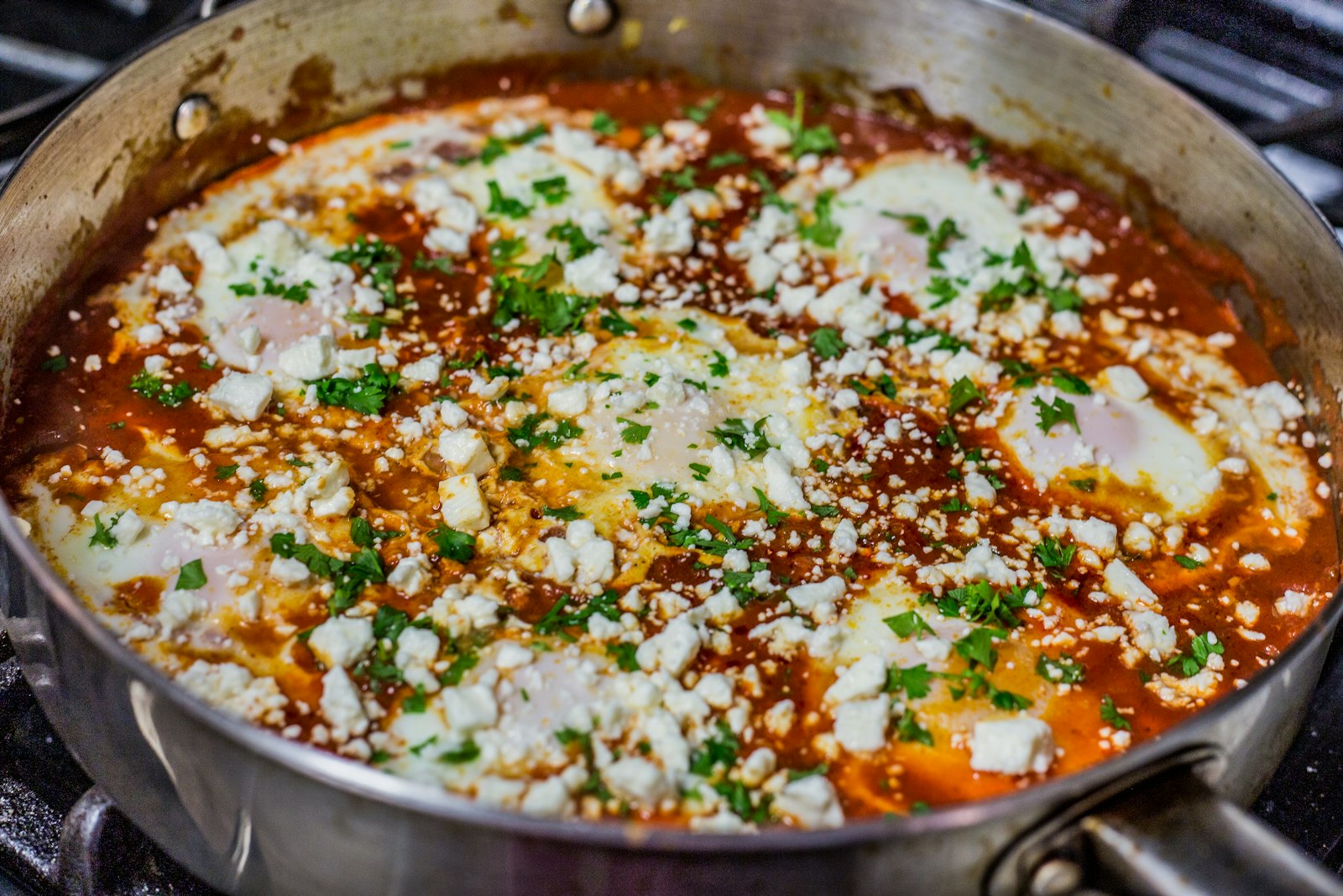 Spicy dishes: shakshuka with eggs and feta in a pan