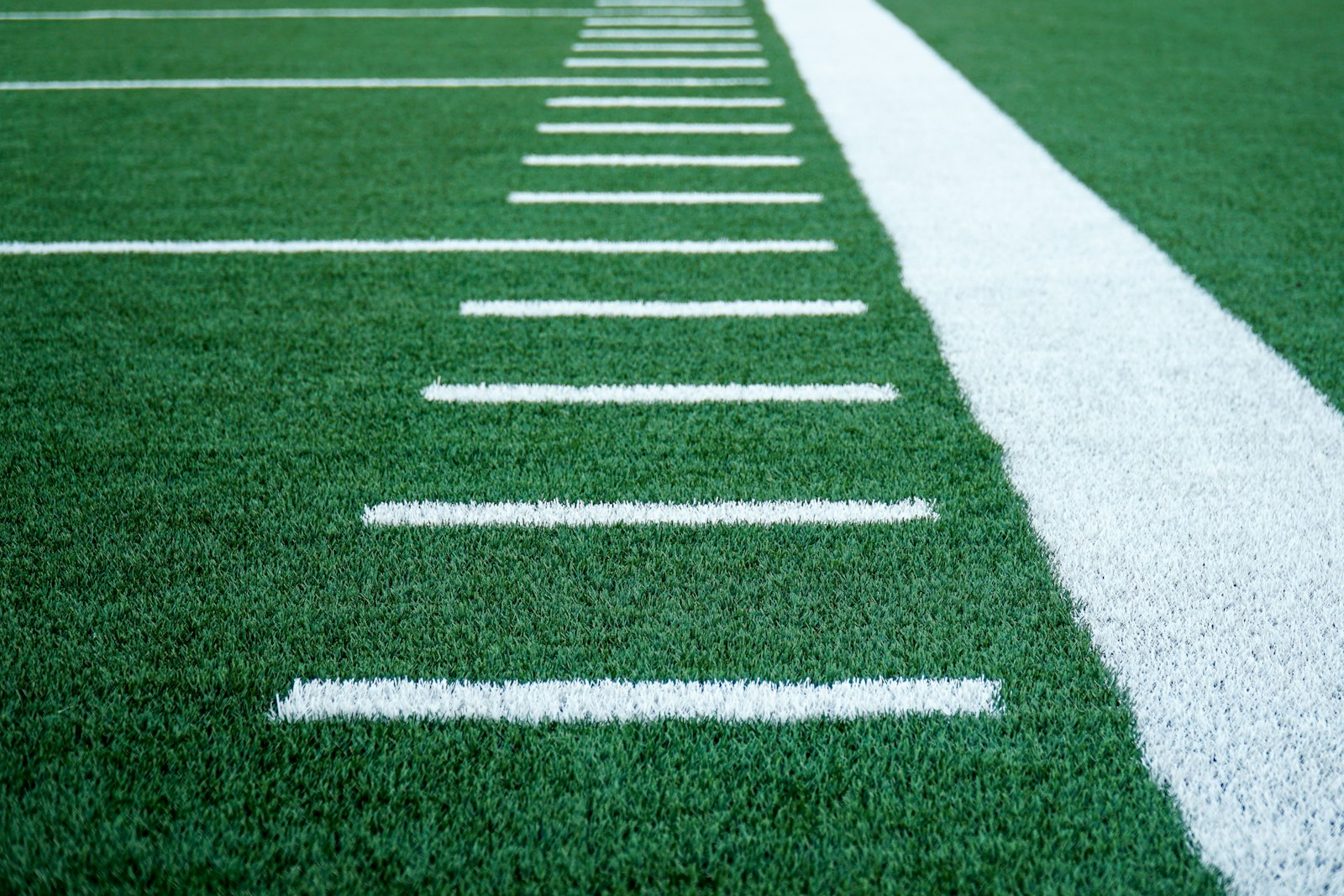 Yard lines on a green football field