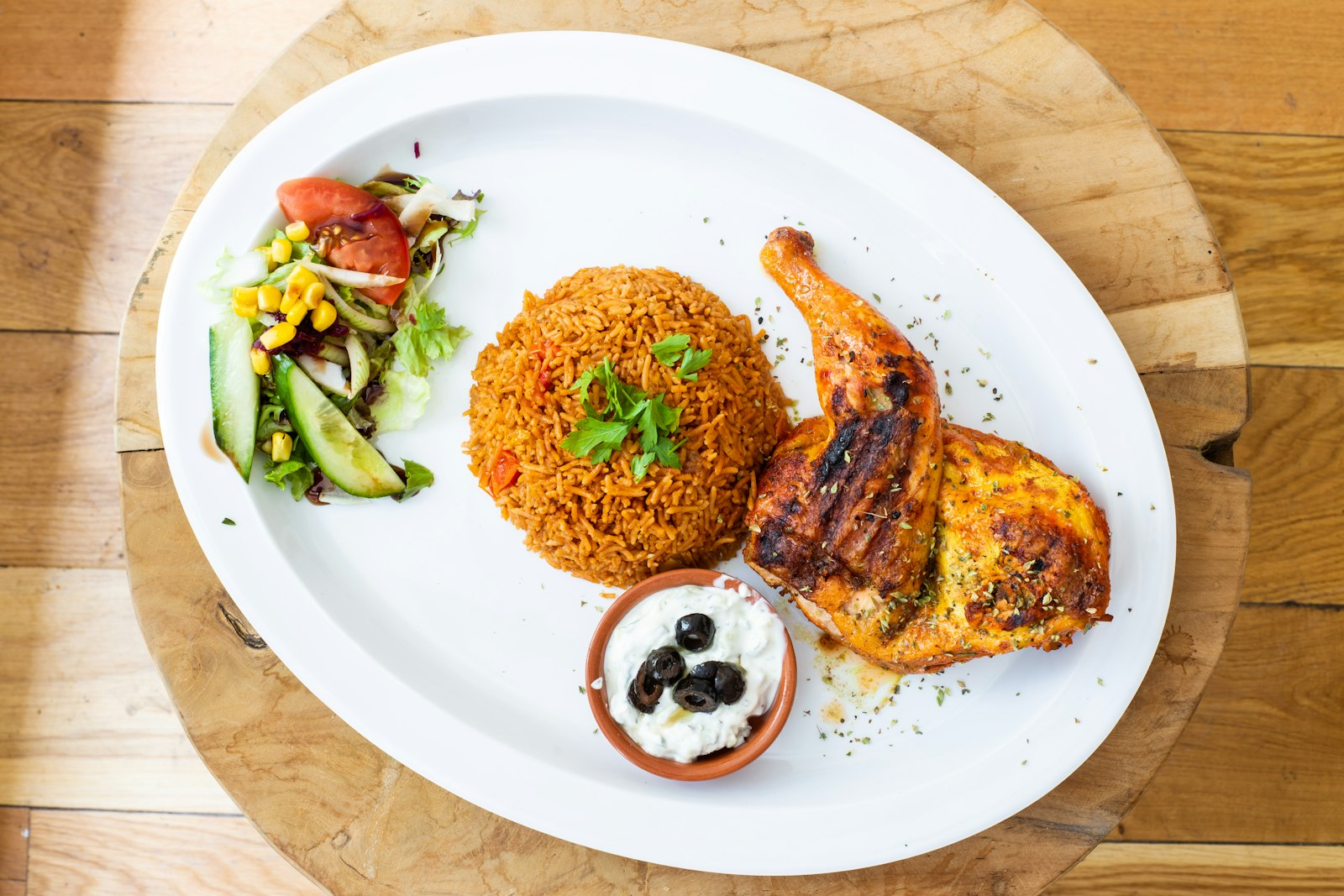 Feeding an NFL team at home: grilled chicken with rice and salad