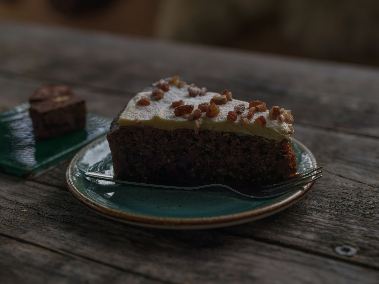 Square of chocolate sheet cake with fudge frosting