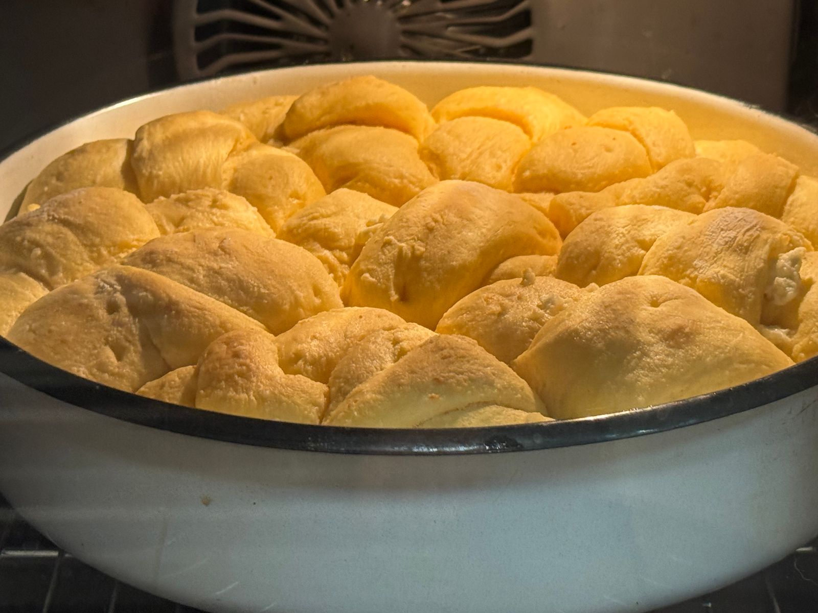 Pan of golden lunch lady yeast rolls fresh from the oven
