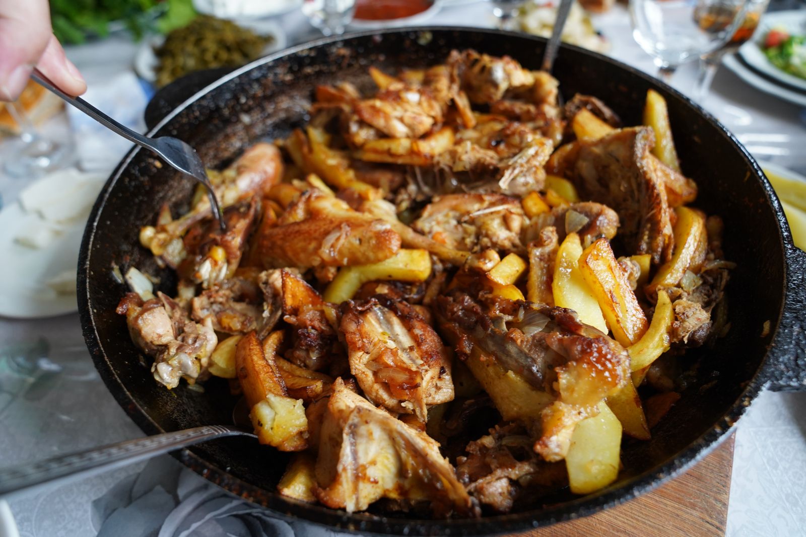 Chicken and crispy potatoes in a skillet