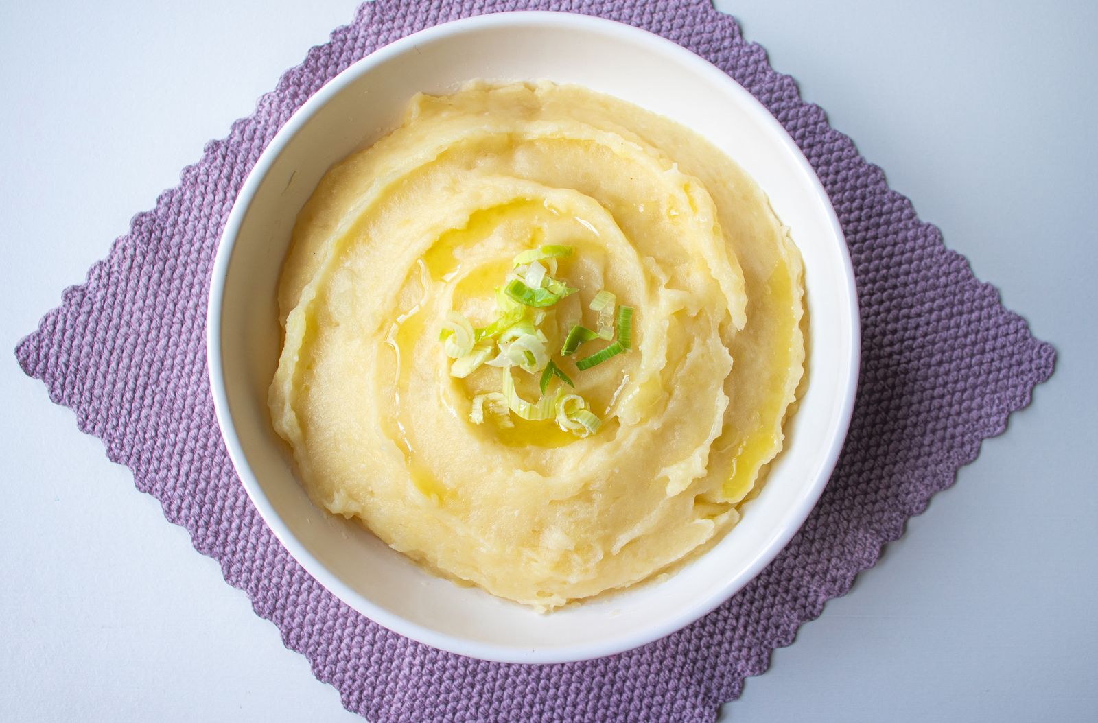 Creamy make ahead mash in a white bowl