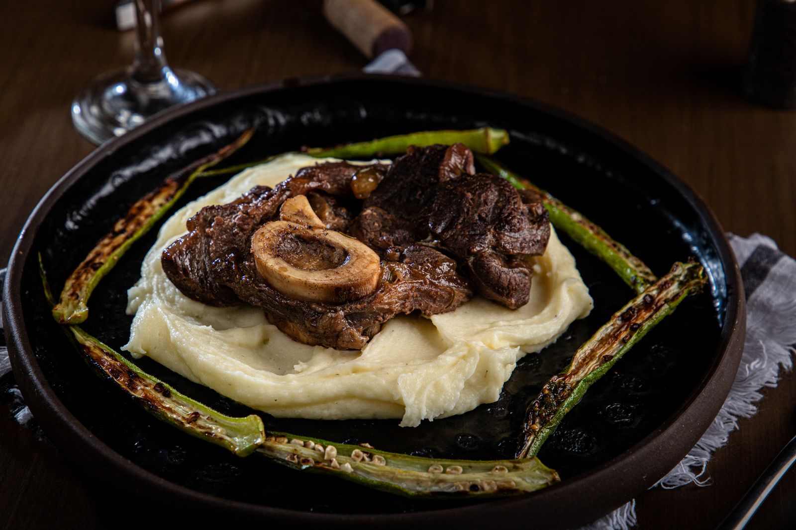 Roast beef served over creamy mashed potatoes