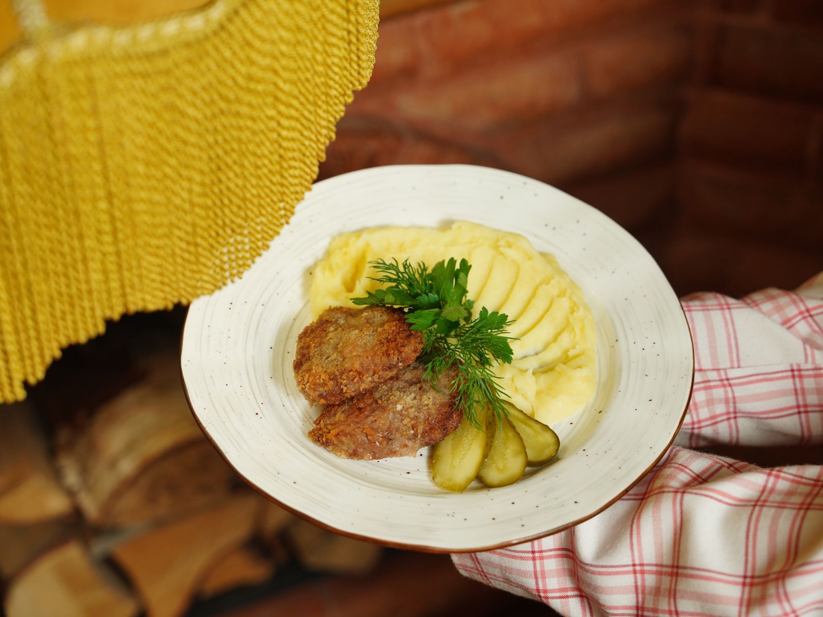 Mashed potatoes with fresh herbs on a plate