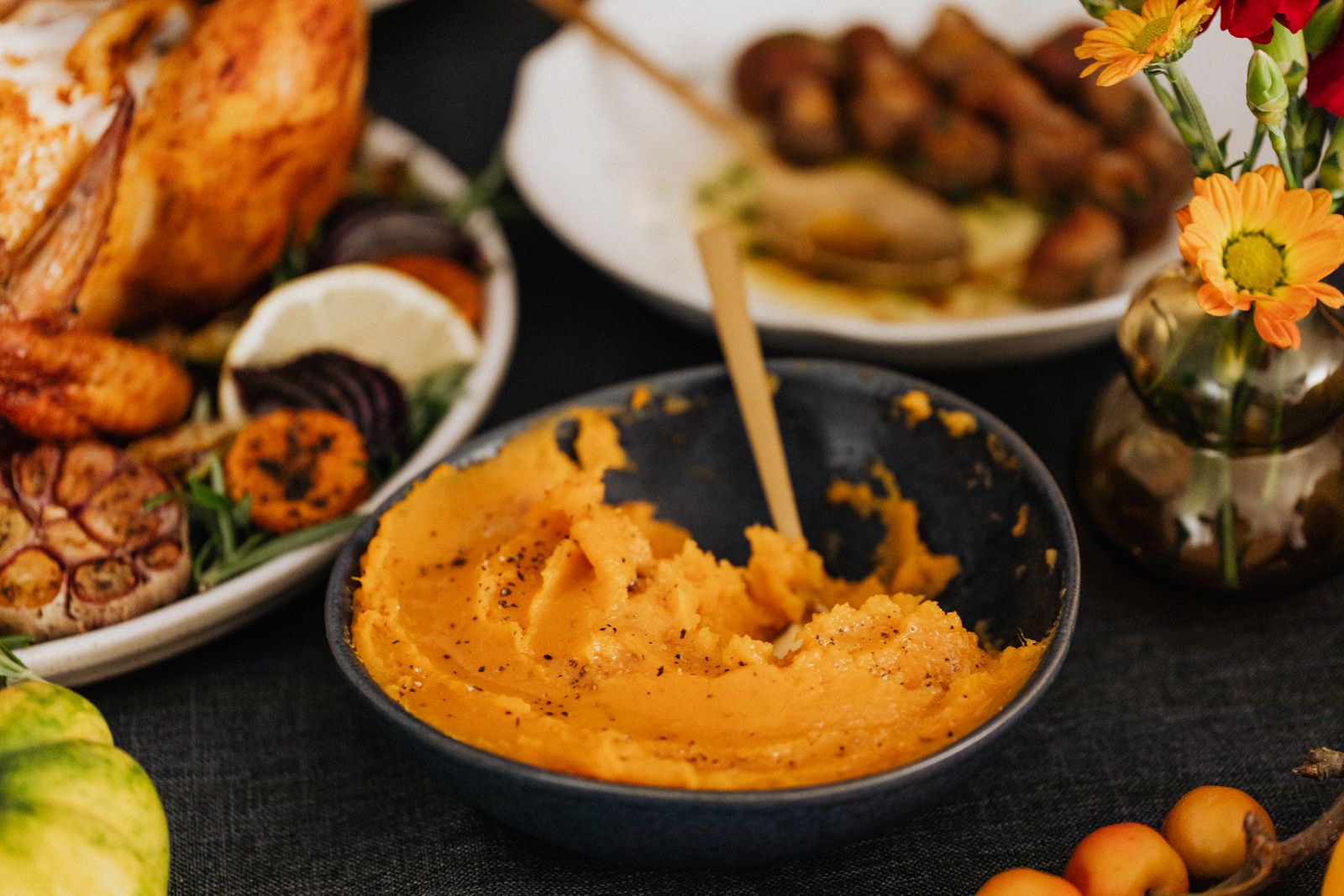 Bowl of sweet potato mash on a dinner table