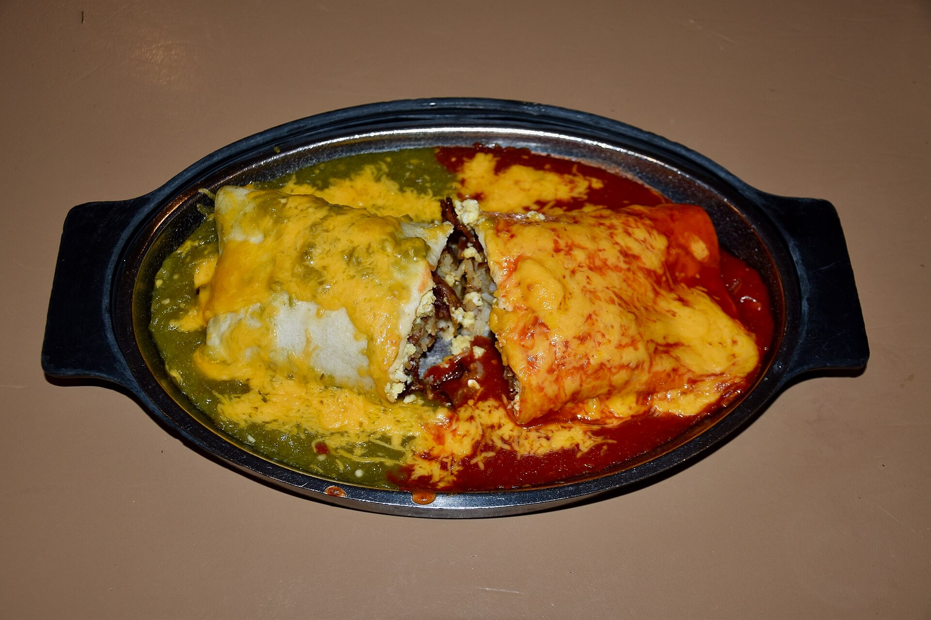 New Mexico style smothered in red and green chile with melted cheese