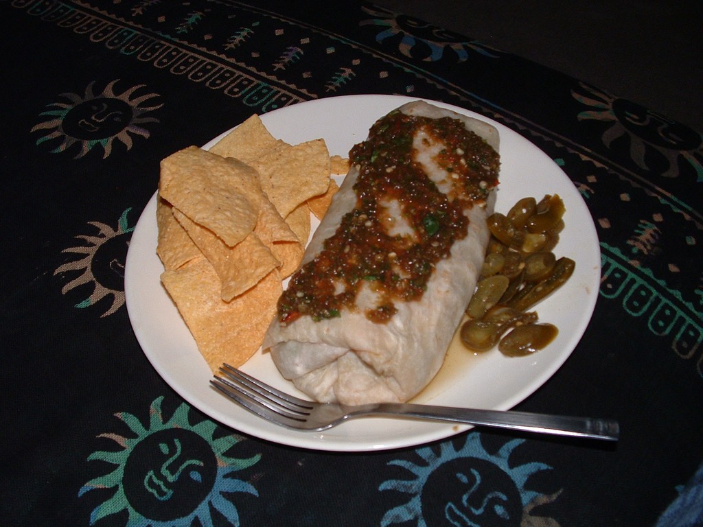 Bean and cheese wrap with green salsa and chips
