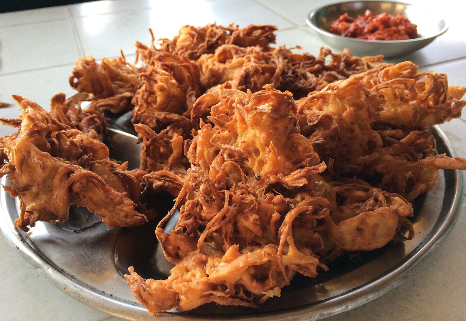 Plate of crispy Indian onion bhaji fritters