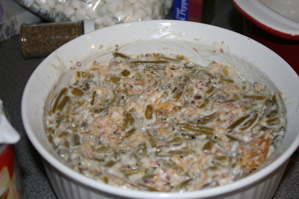 Creamy no mushroom green bean casserole in a white dish