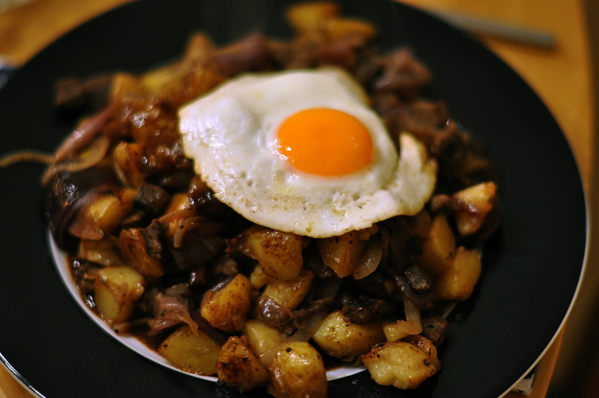 Danish sausage and potato hash topped with a fried egg