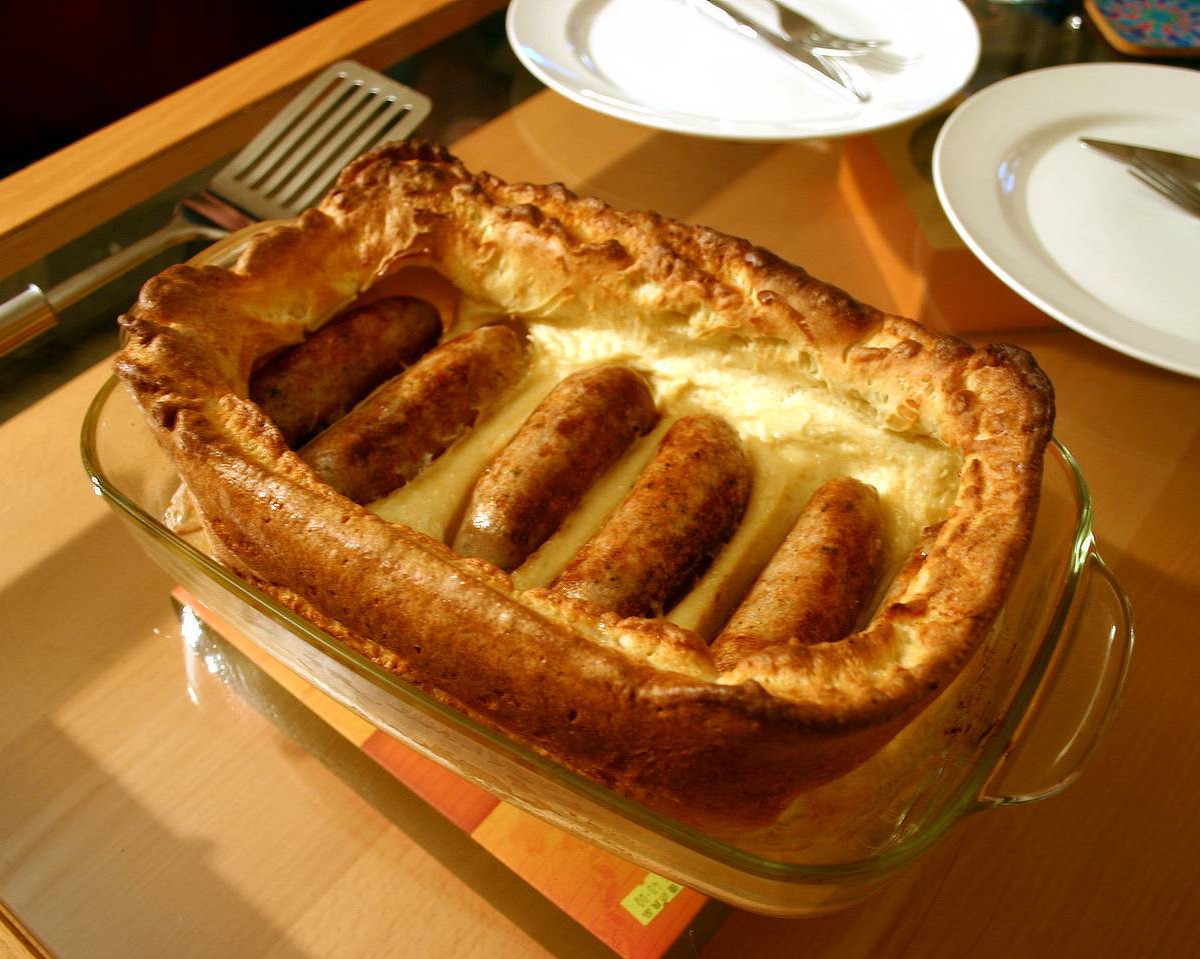 Toad in the hole: sausages baked in puffed Yorkshire pudding batter