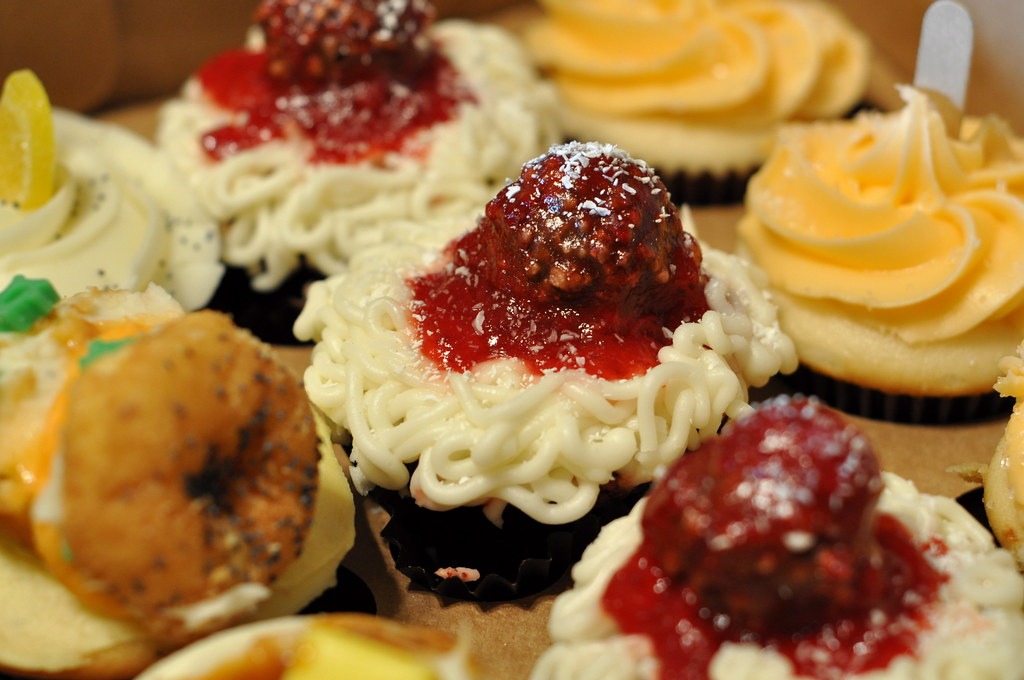 Spaghetti and meatball cupcakes with buttercream noodles and strawberry sauce
