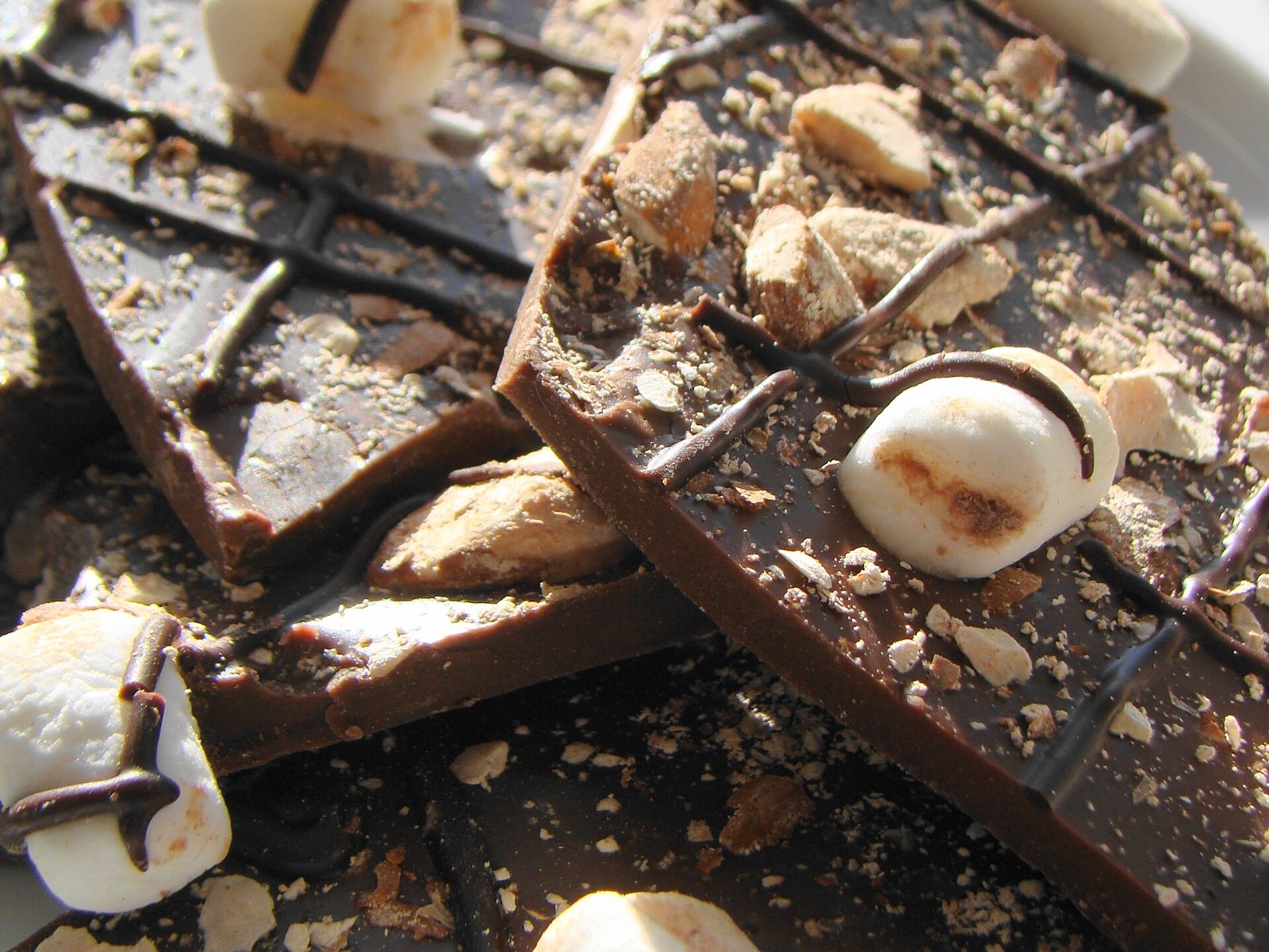 Dark chocolate bark pieces with marshmallows and almonds