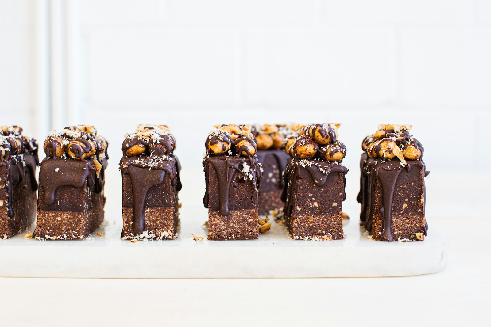 Chocolate biscuit slice bars topped with nuts