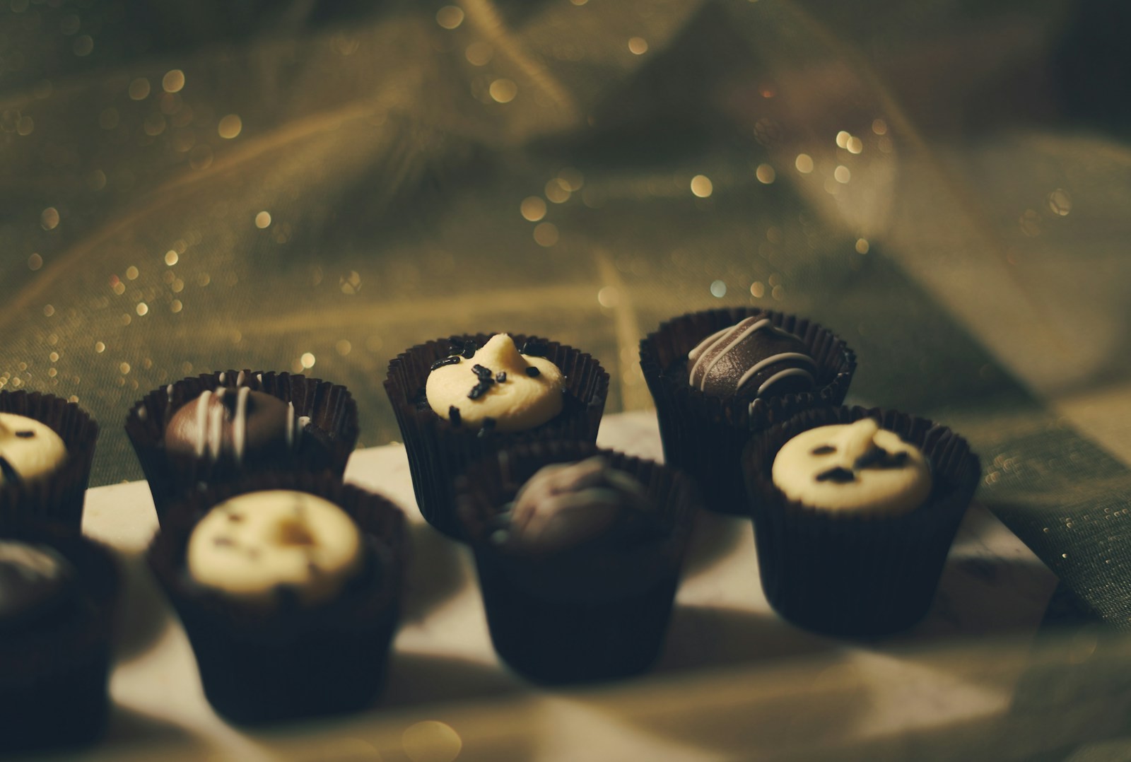 Mini chocolate cups in dark paper liners