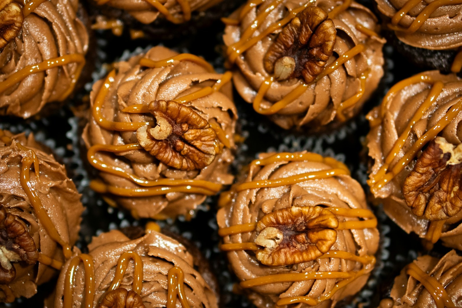Pecan and caramel Texas millionaires in paper candy cups