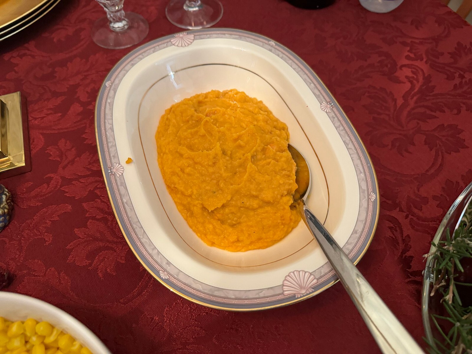 Creamy orange mash in an oval serving dish on a holiday table