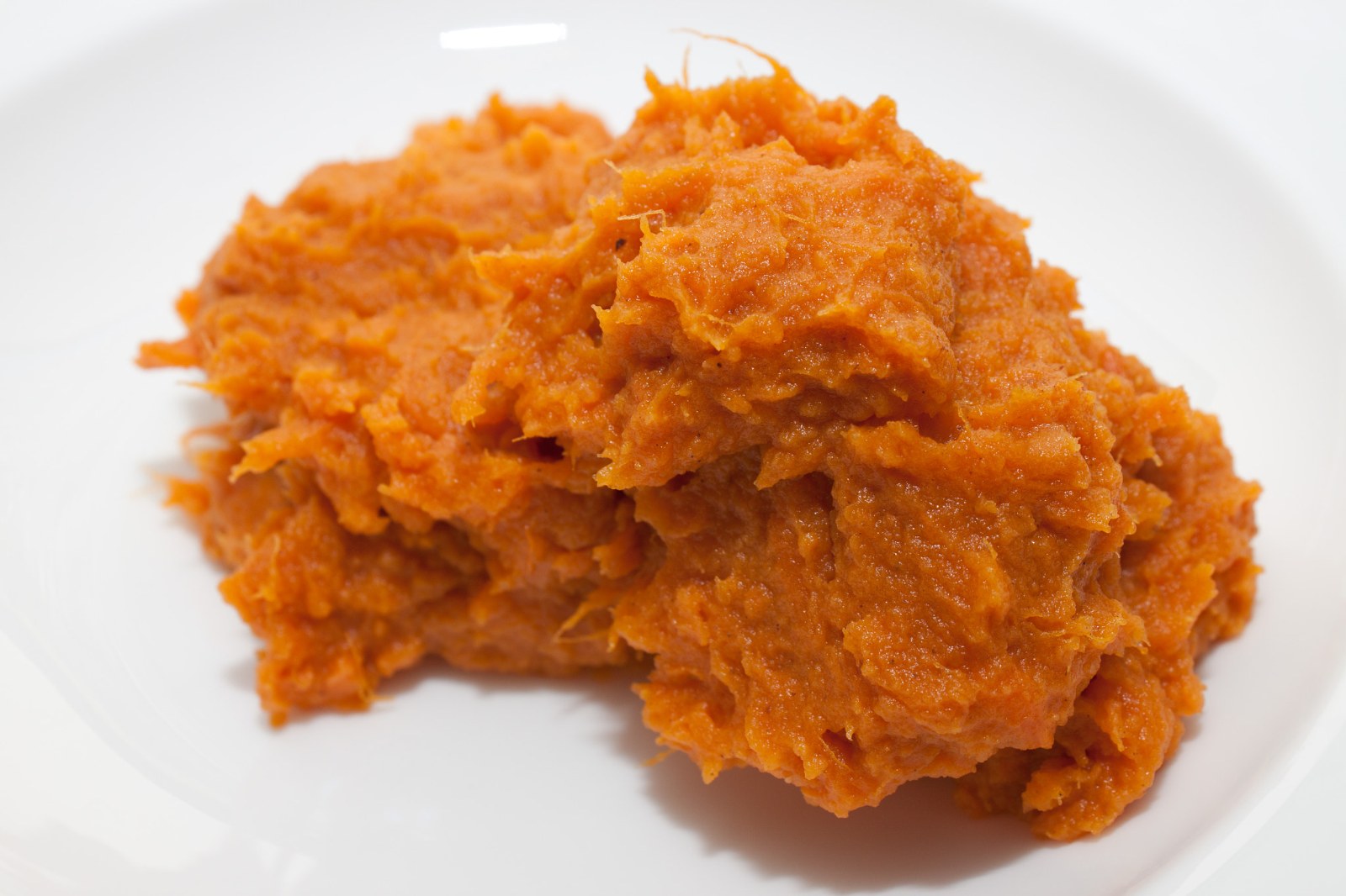 A plate of smooth orange mash