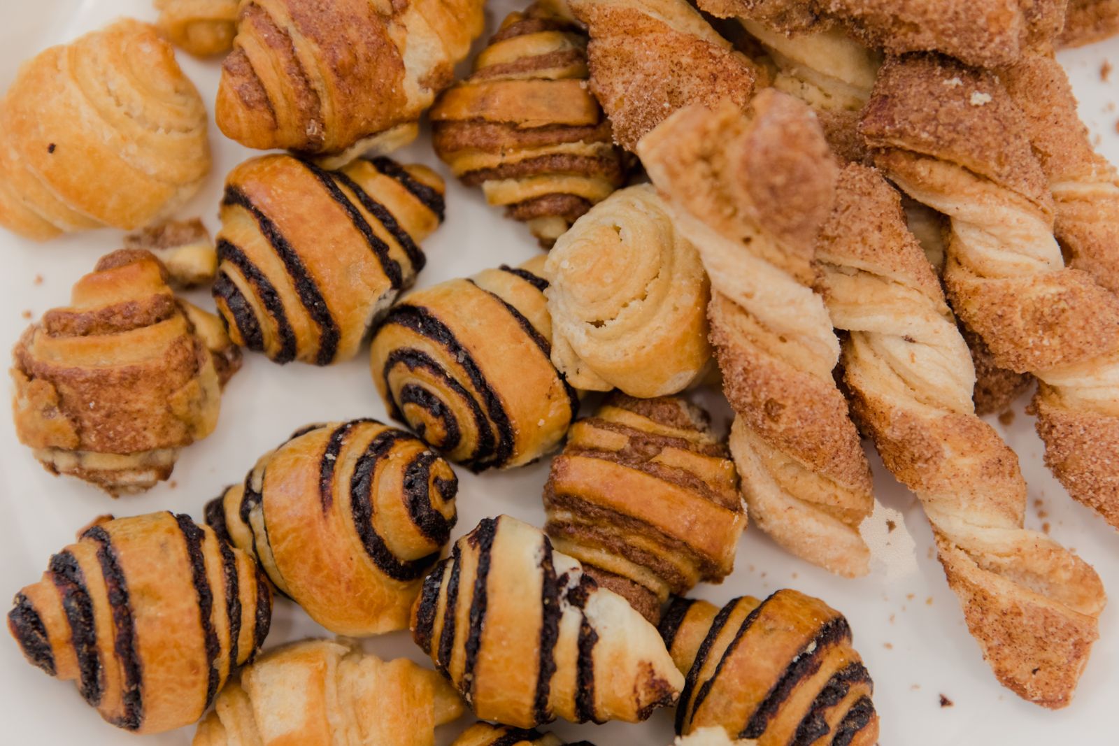 Sugared puff pastry twists and rolled pastries