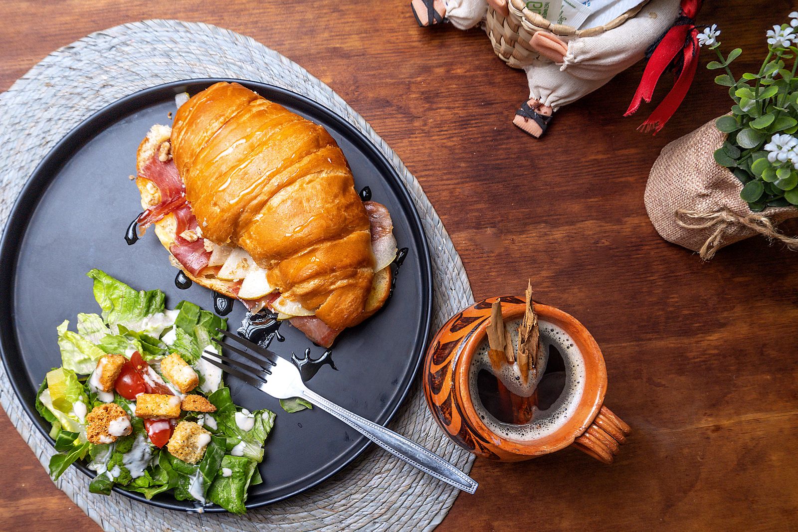 Baked ham and cheese sandwich with a fresh side salad