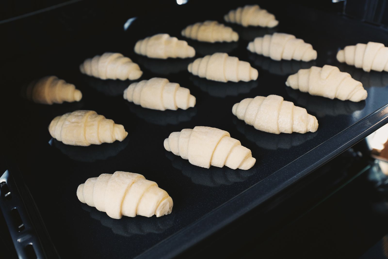 Shaped pastry dough on a baking tray before baking