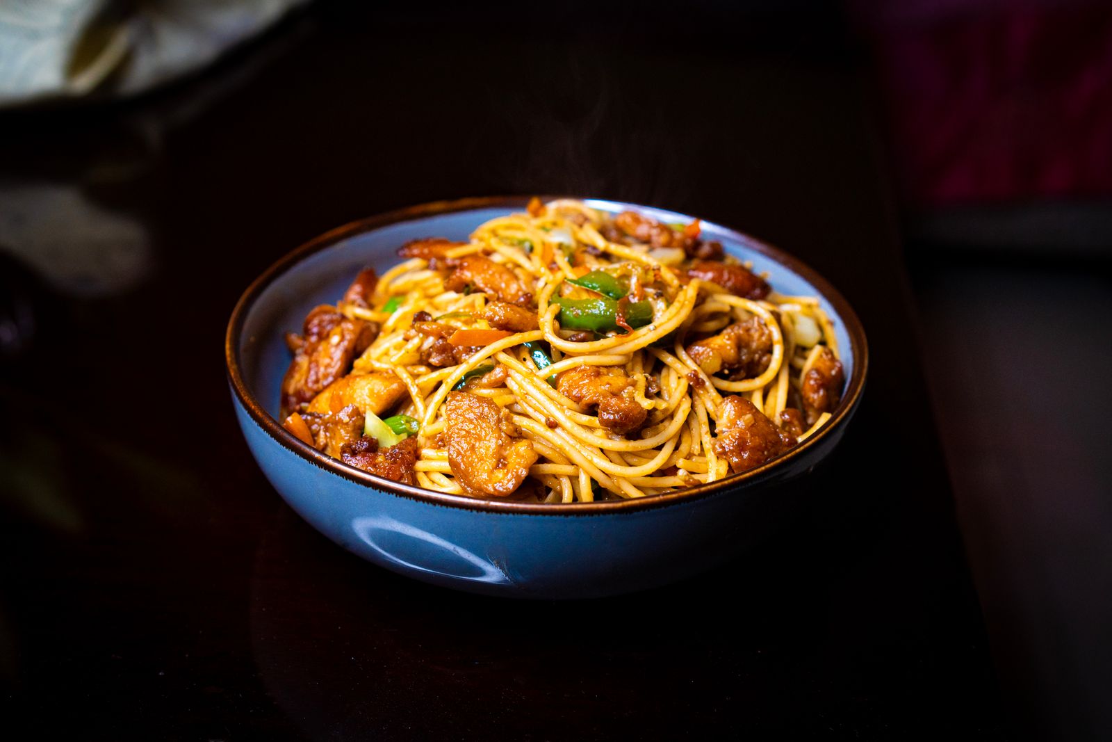 Spicy Tex-Mex pasta with peppers in a blue bowl