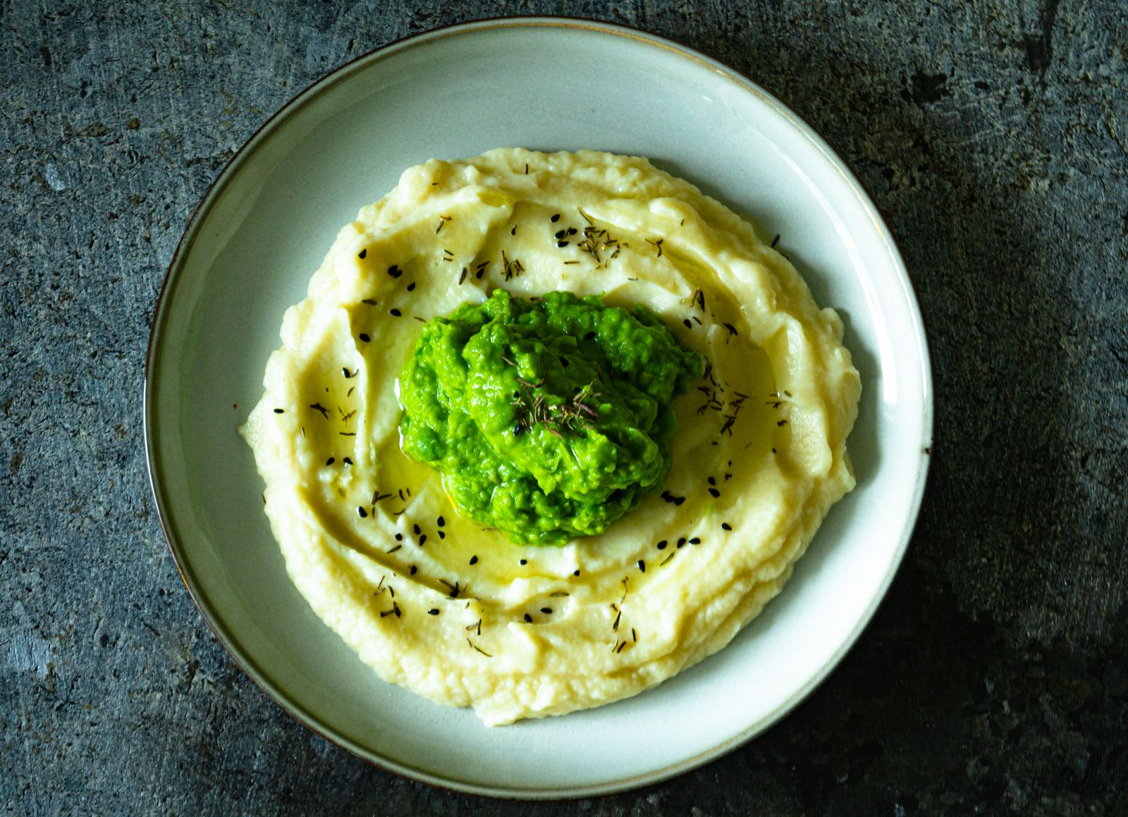 Mashed potatoes topped with smashed peas