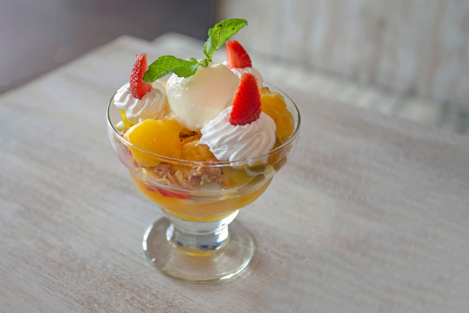 Mini fruit trifle cup with cream and strawberries