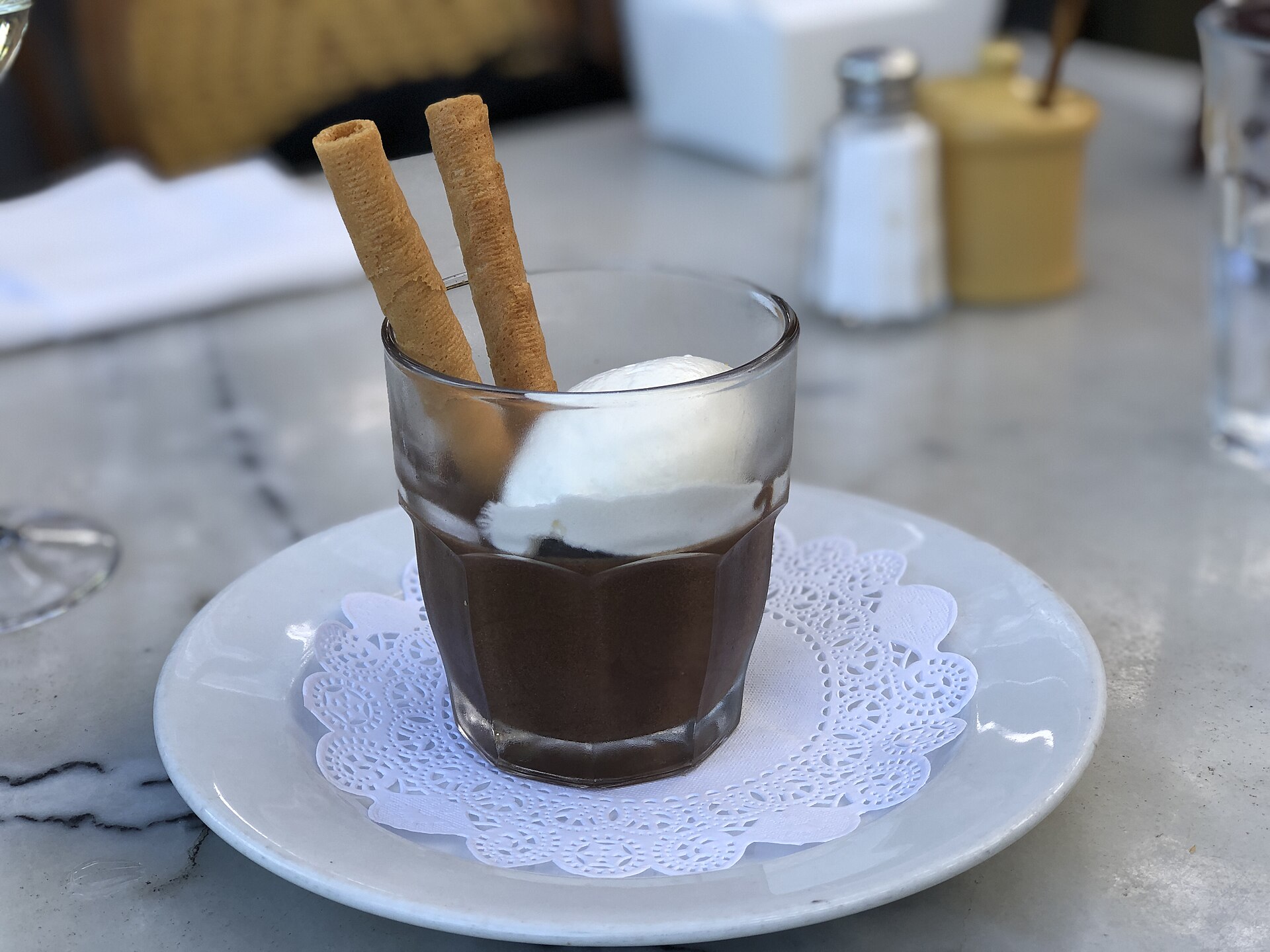 Coffee dessert in a glass with wafer cookies