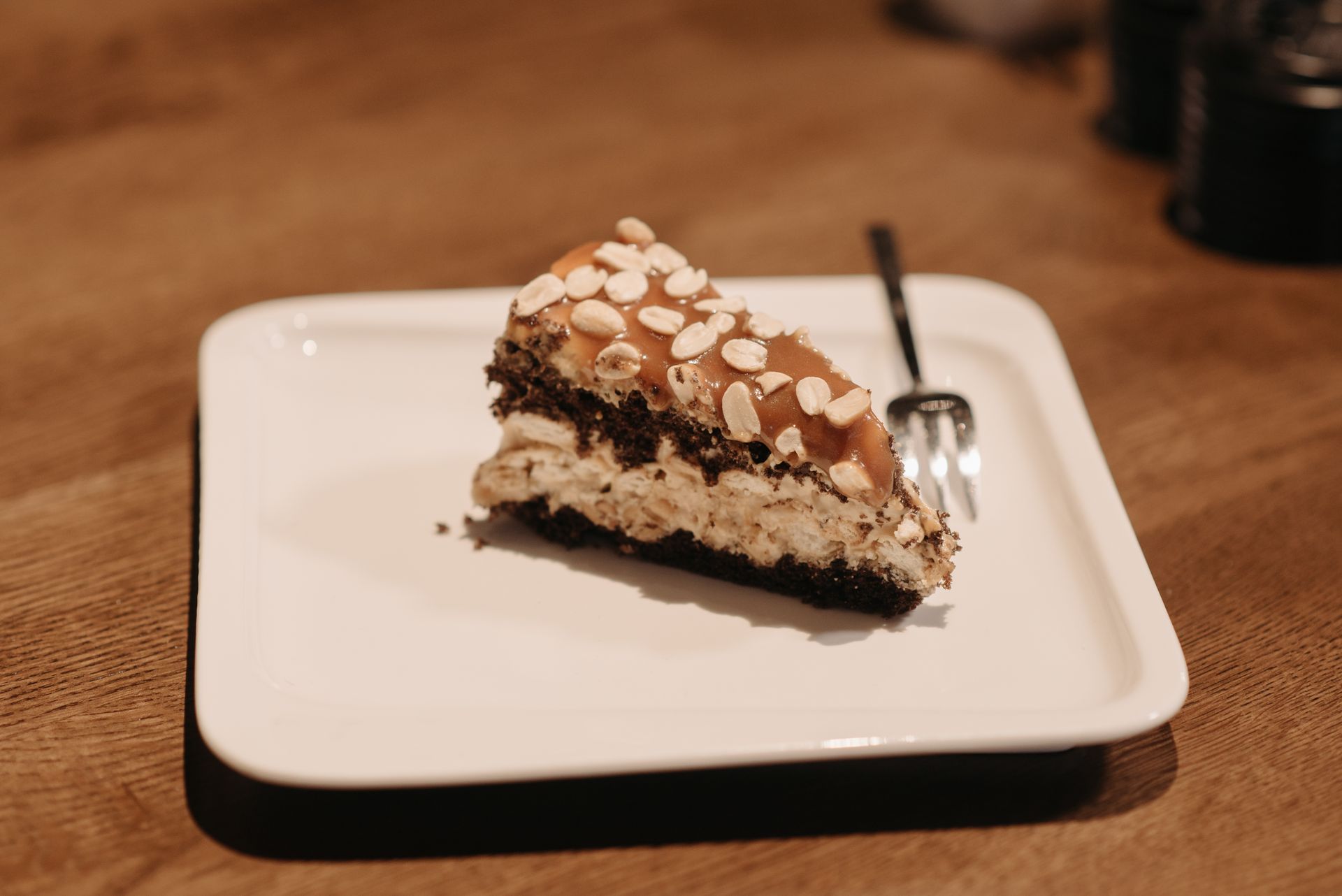 Peanut butter layered slice with peanuts