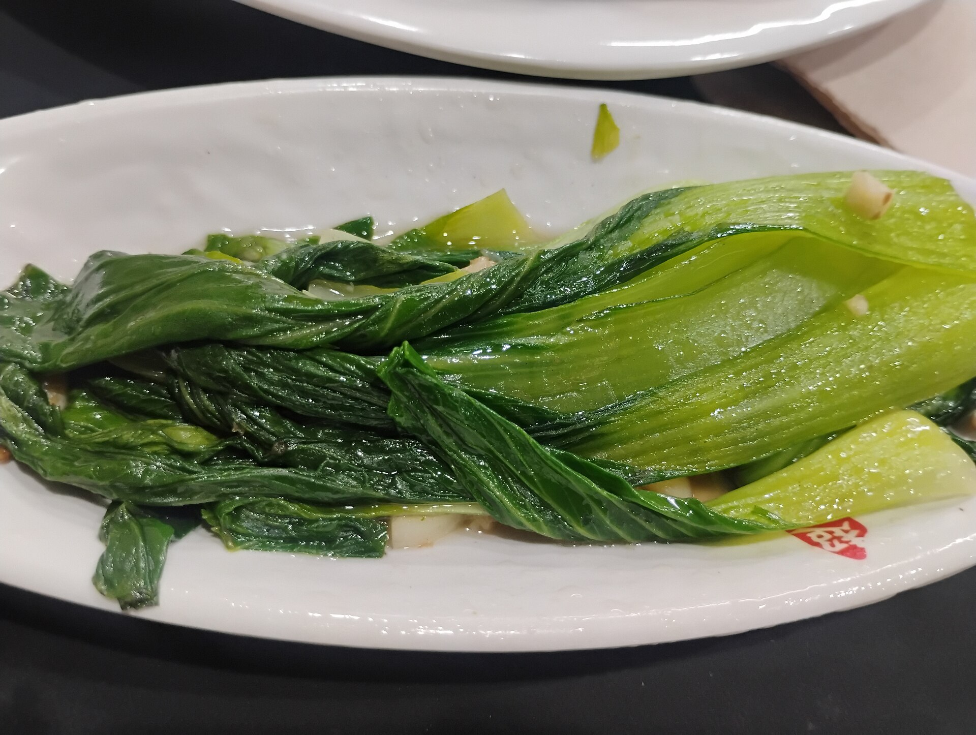 Stir fried garlic bok choy on a plate