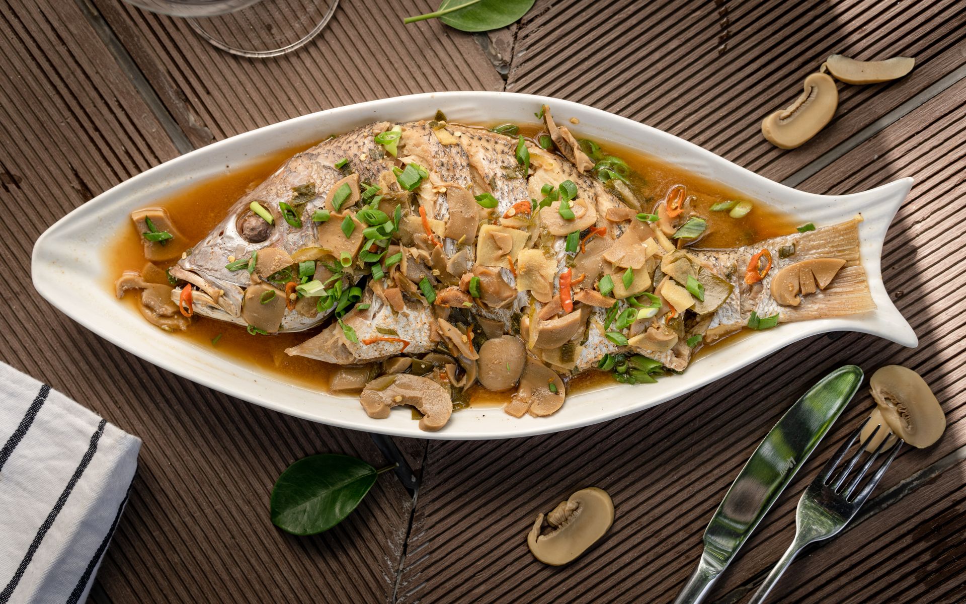 Ming-Na Wen recipes: steamed fish with herbs and mushrooms on a fish shaped platter