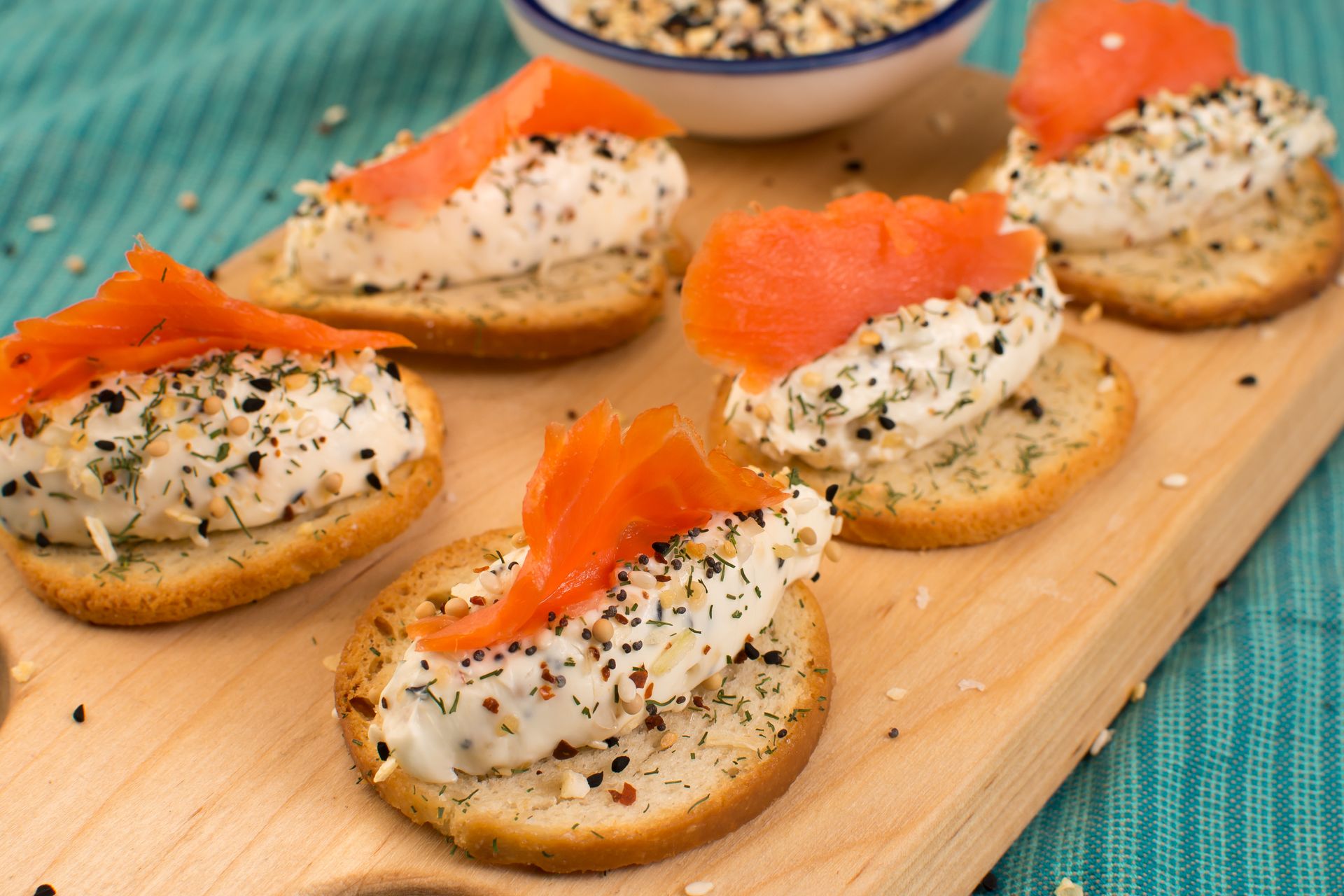 Smoked salmon and cream cheese canapes on a board