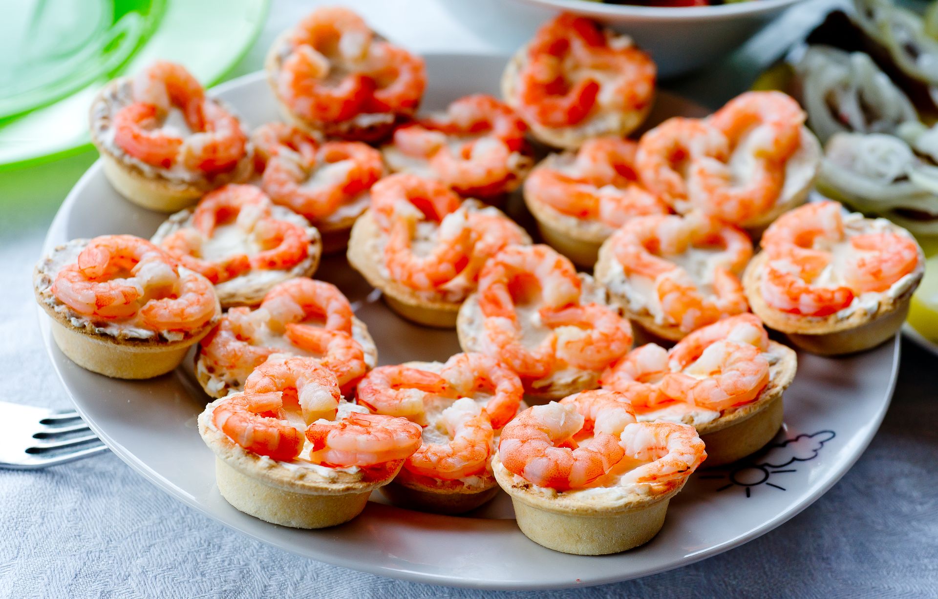 Phyllo cup appetizers topped with boiled shrimp