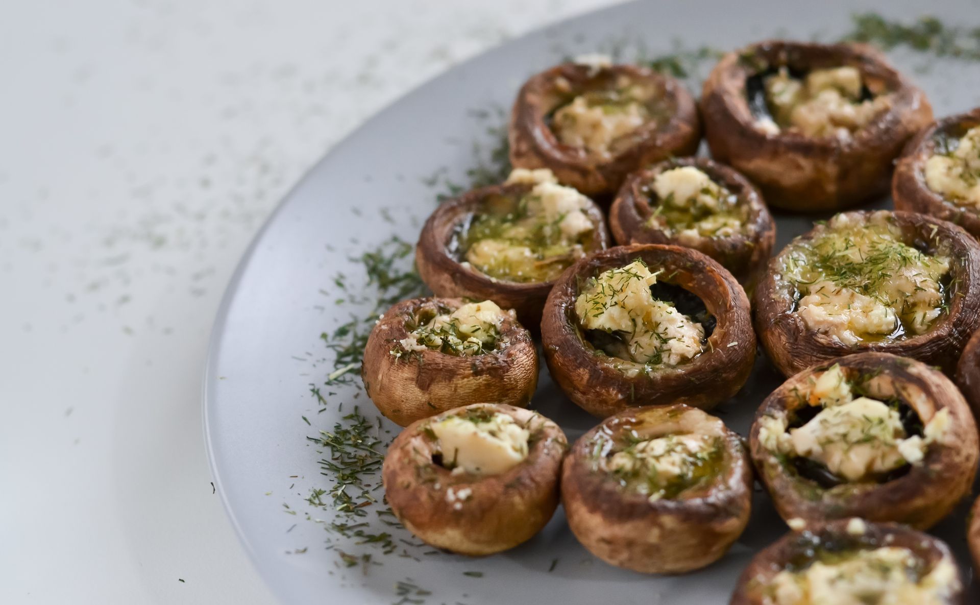 Stuffing mix recipes: stuffed mushrooms with herbs on a gray plate