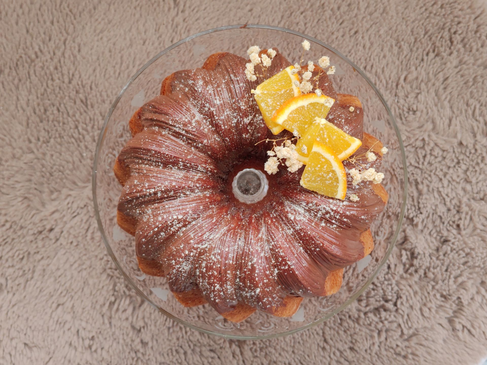 Sticky toffee pudding Bundt cake topped with orange slices