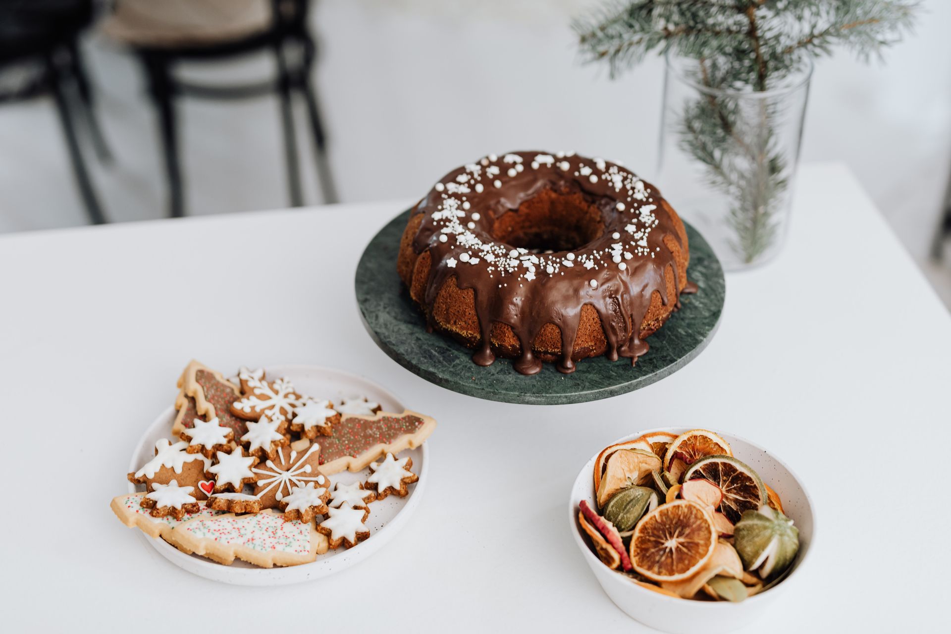 Spiced Bundt cake with a chocolate drizzle and holiday decorations