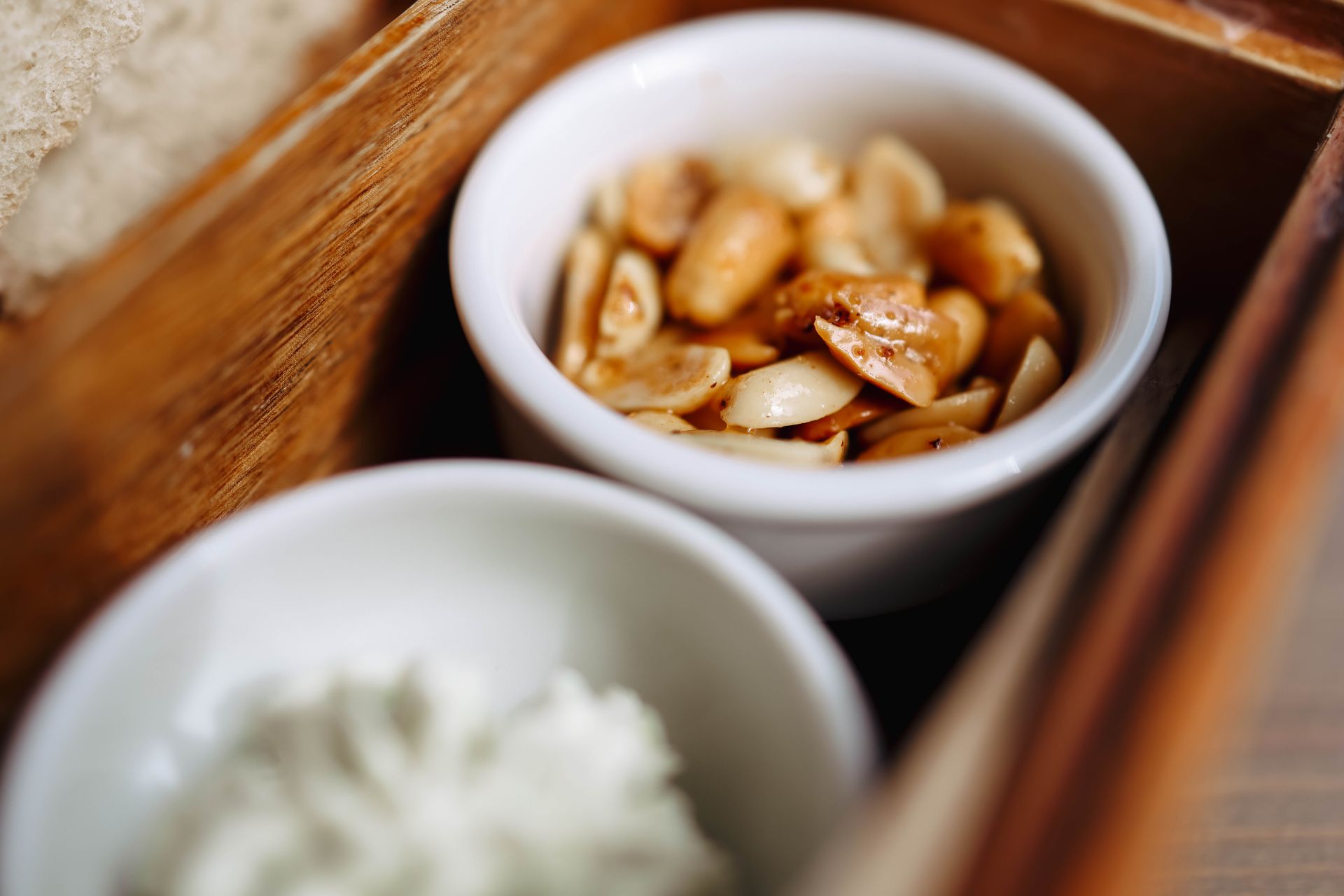 Chili lime peanuts in a small white bowl