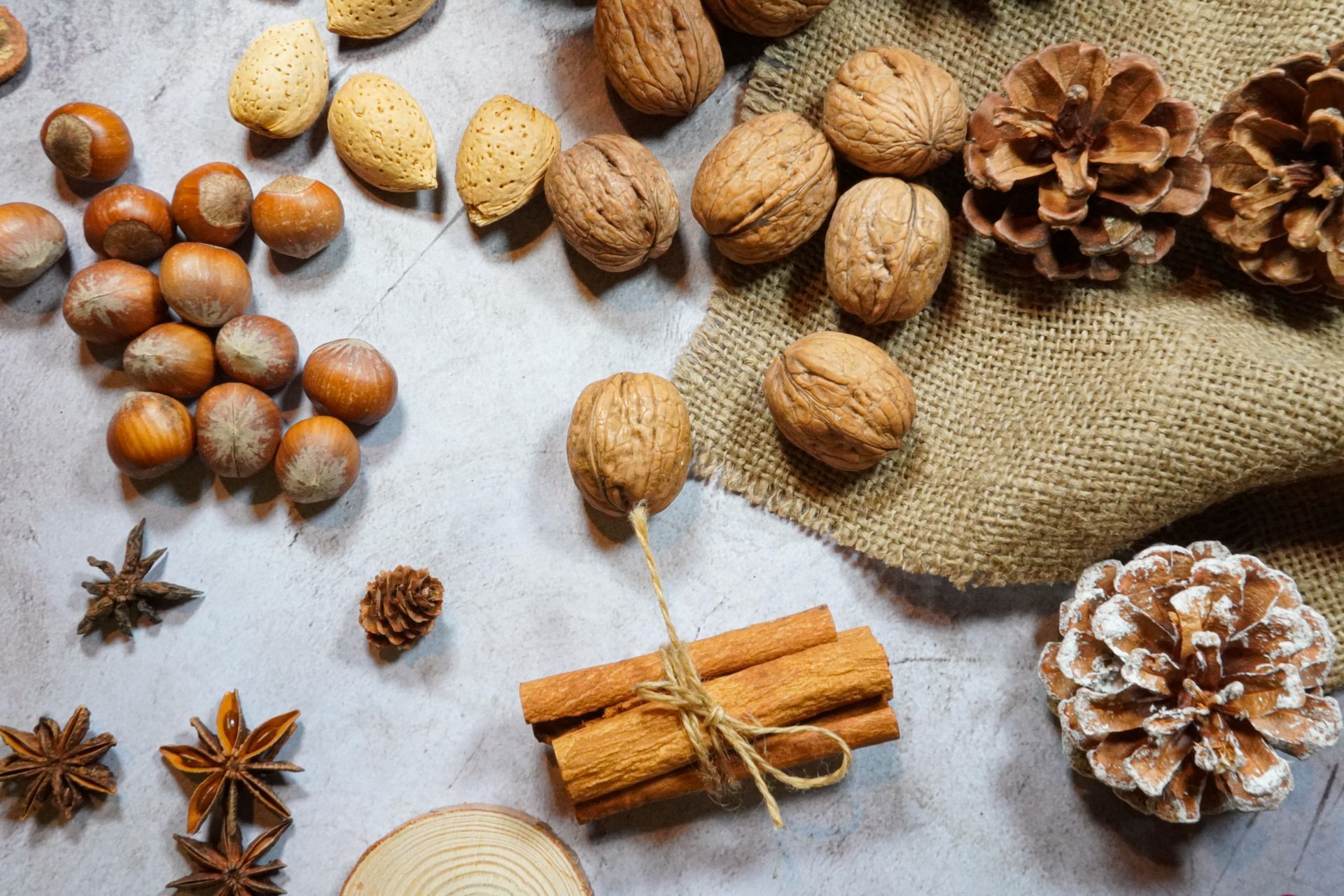 Mixed nuts with cinnamon sticks and star anise for orange cardamom spiced nuts