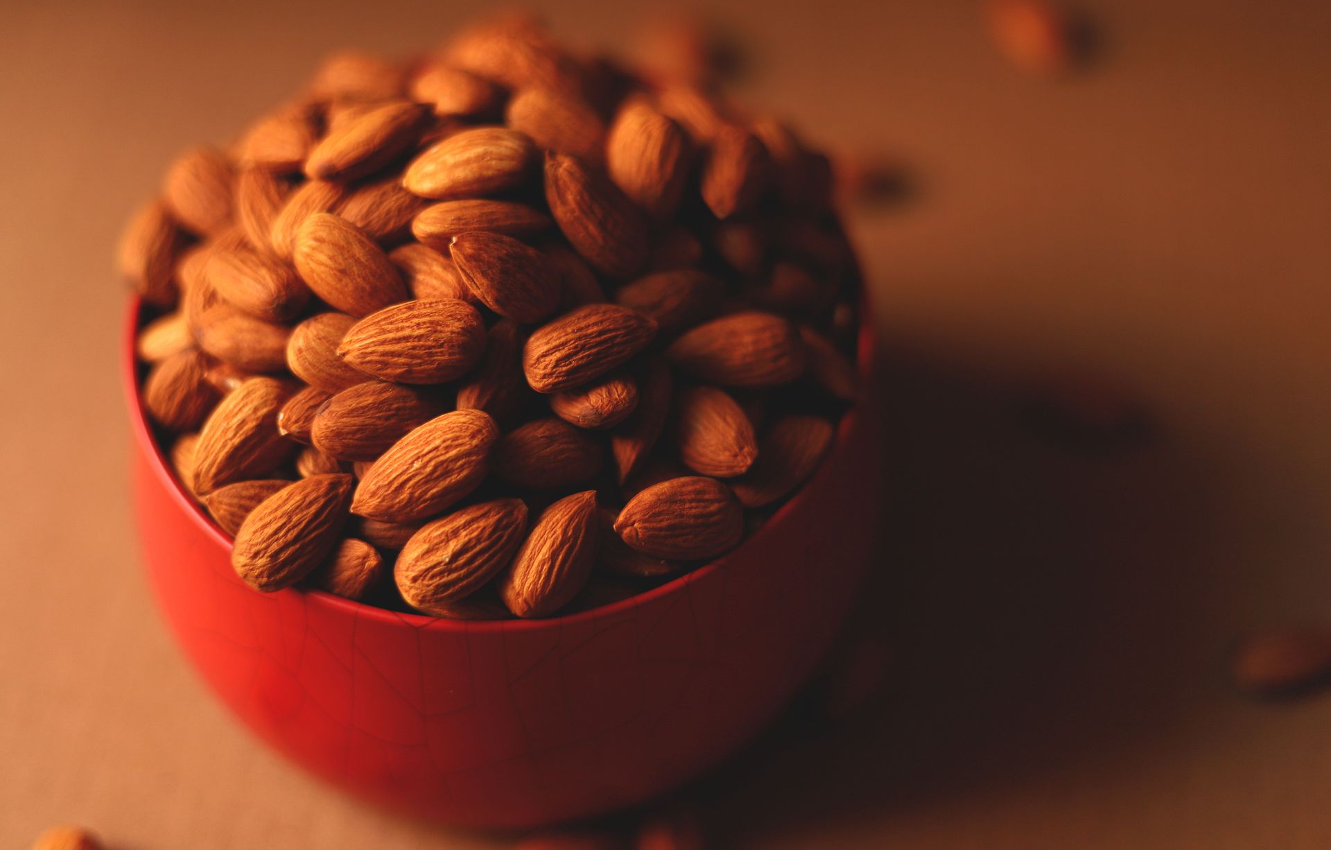 Smoky paprika almonds in a red bowl