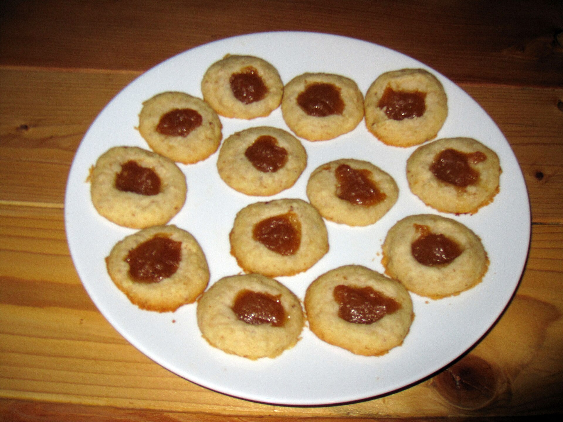 Simple jam thumbprint cookies on a white plate