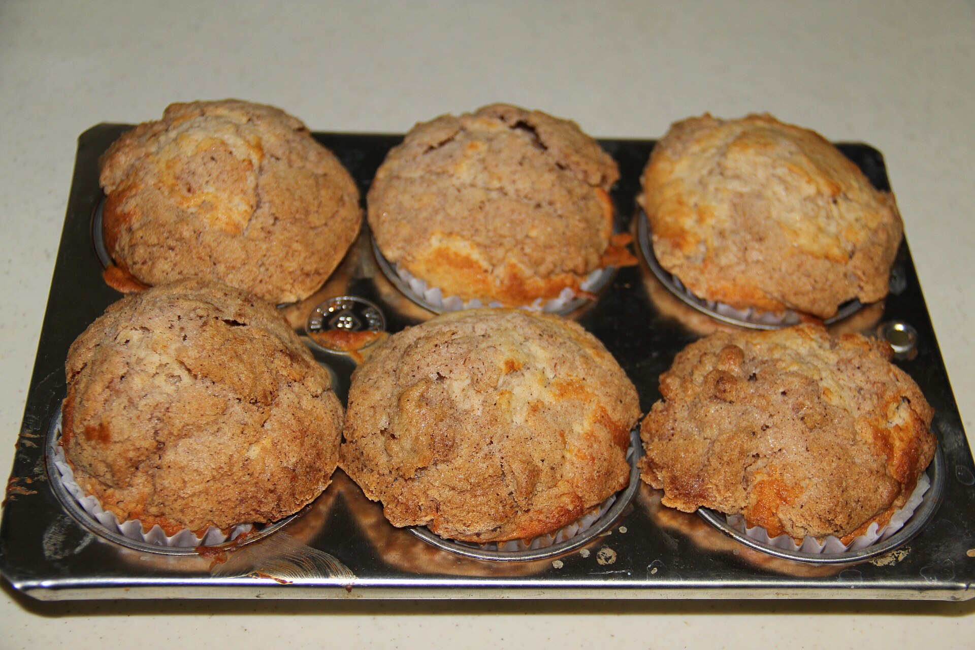 Cinnamon sugar muffins in a muffin tin