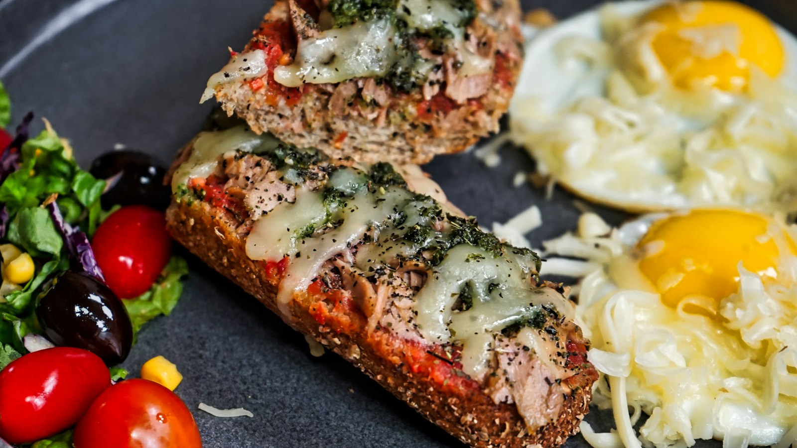 Italian style loaf slices with melted mozzarella