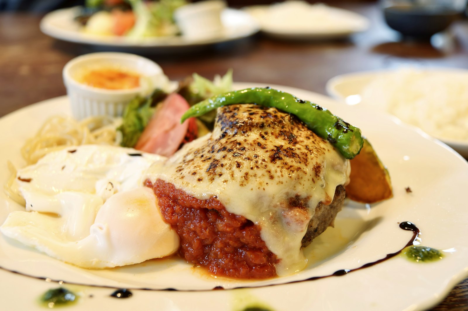 Slice of beef loaf with melted cheese on top