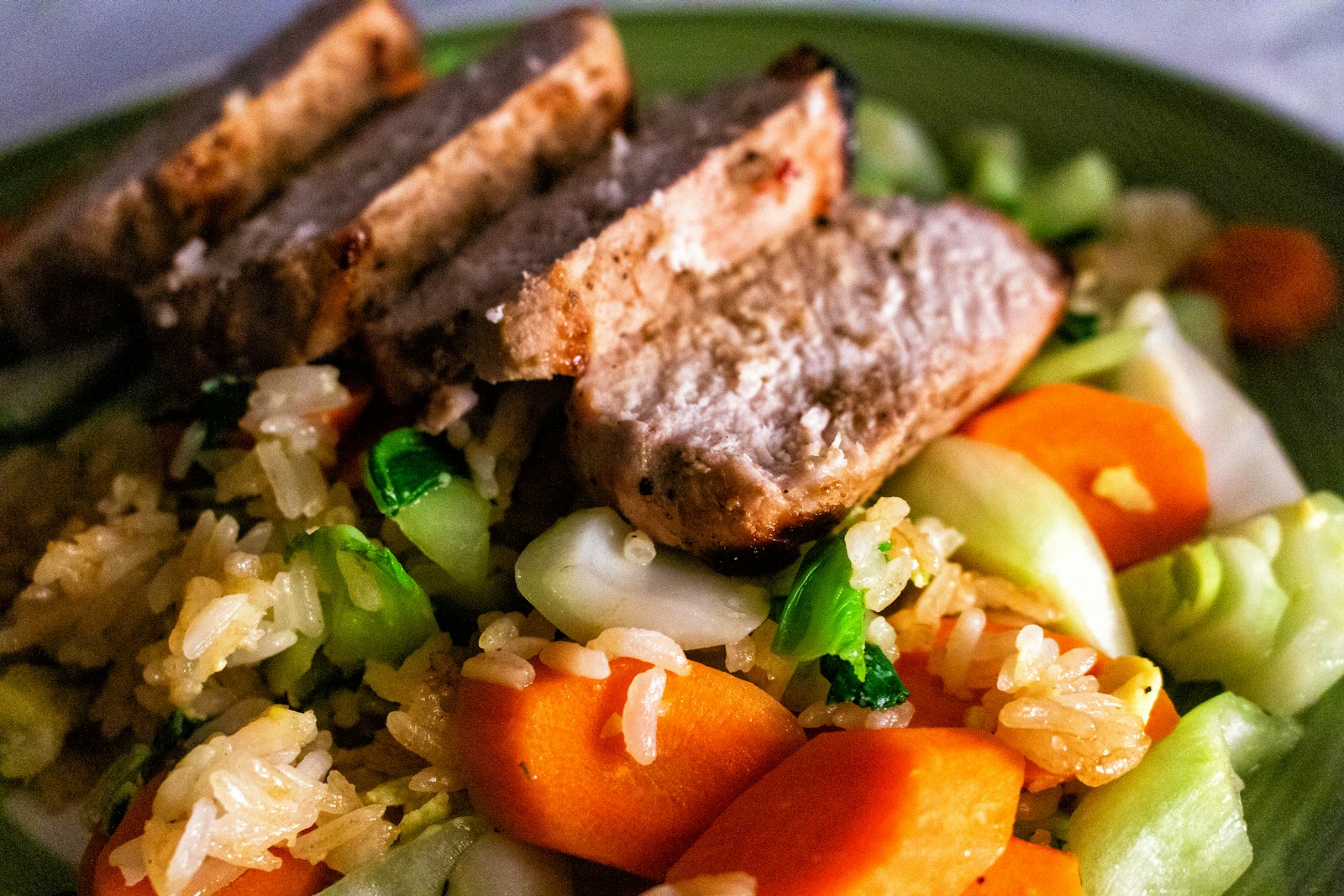 Lighter turkey loaf slices served with roasted vegetables