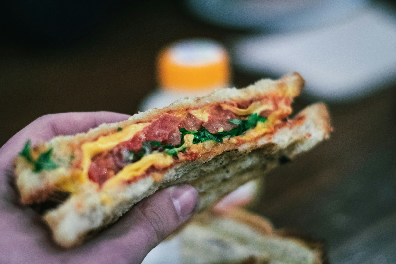 Grilled sandwich with greens cut in half