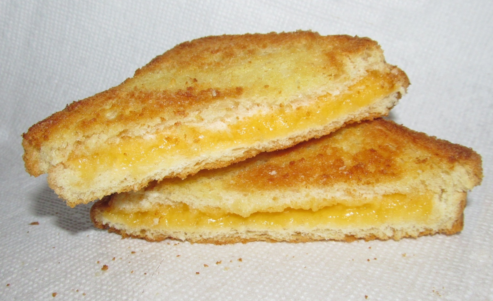 Grilled cheese sandwich cut in half